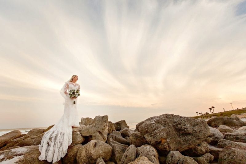 Military Beach Weddings - bride standing on rocks