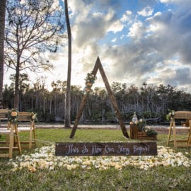 outdoor wedding ceremony with arbor