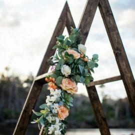 Wooden triangle arch used in outdoor wedding in Georgia