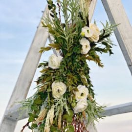 Arbor flowers decorating wedding triangle arch in Georgia