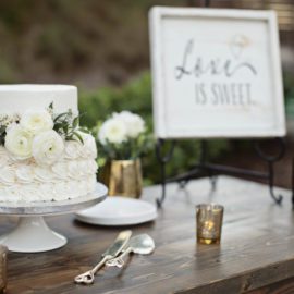 white wedding cake with white roses