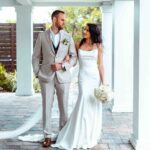 a couple looking at each other about to get married, non wedding ceremony, beach commitment ceremony