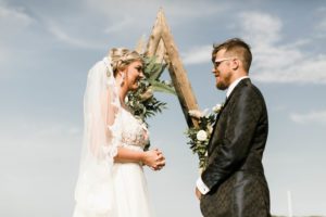 a man and a woman exchanging vows on a beach in st augustine, fl, beach wedding, florida wedding planner 