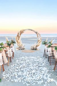 a beautiful boho beach wedding with flowers in the aisle, how to include your child in your wedding ceremony, beach wedding