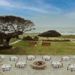 an aerial shot of an outdoor beach wedding reception in florida, wedding timeline, florida beach wedding